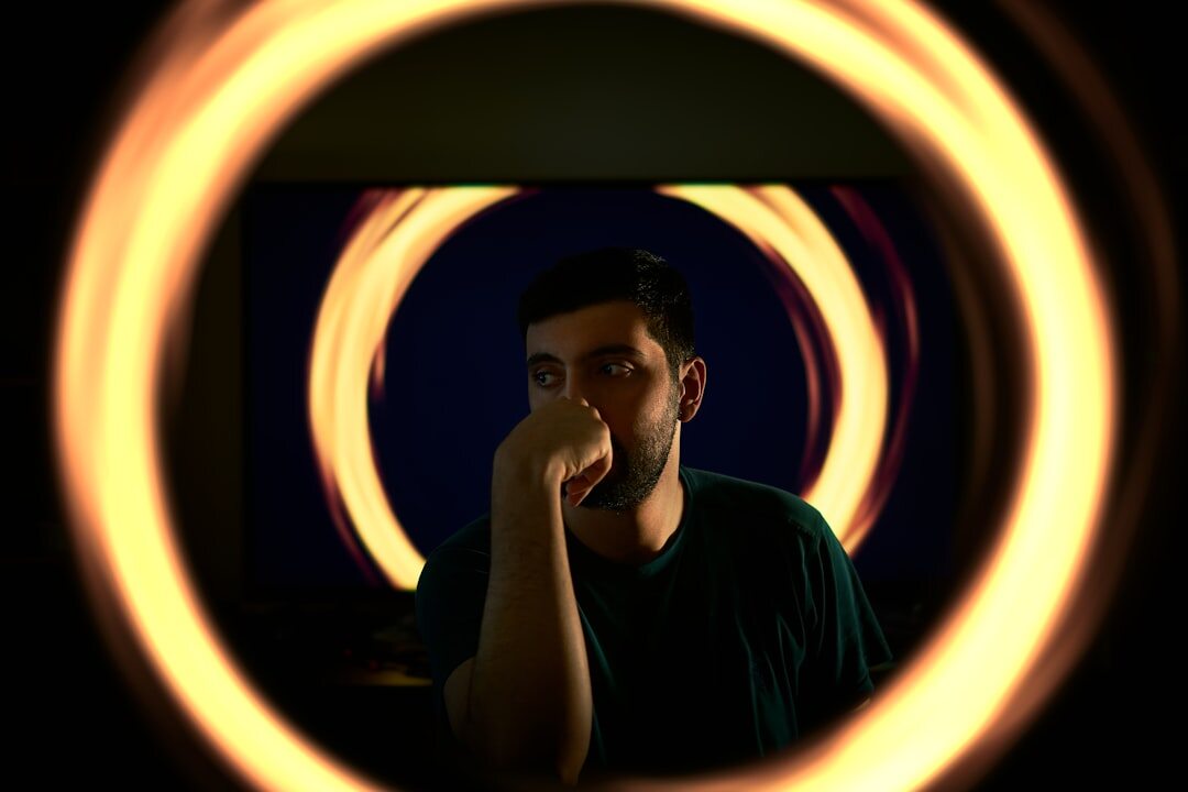 Person speaking confidently in front of a ring light and camera during on camera training